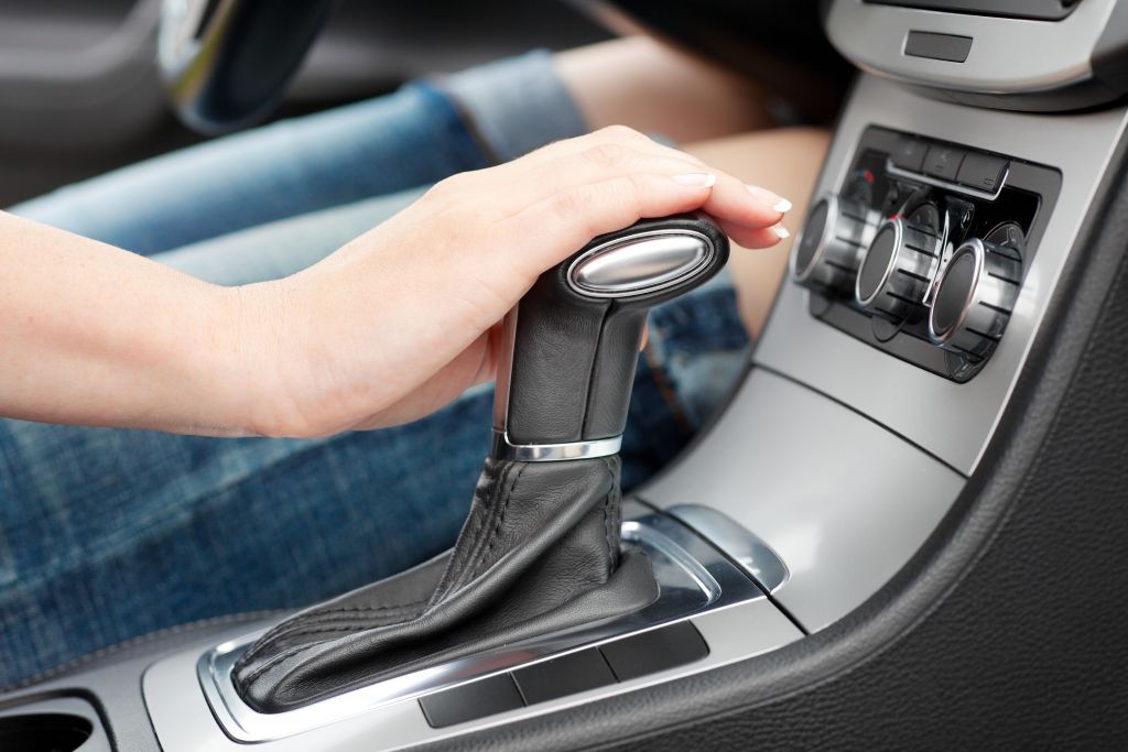 hand_on_automatic_gear_shift-_woman_in_luxury_car